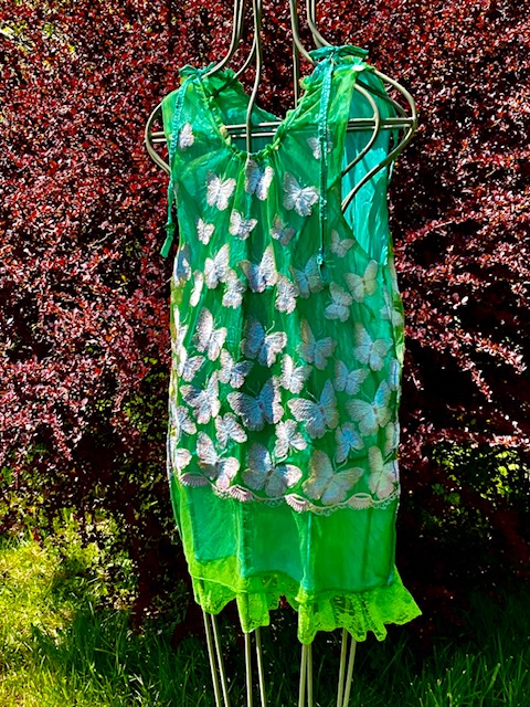 Green dress on mannequin.